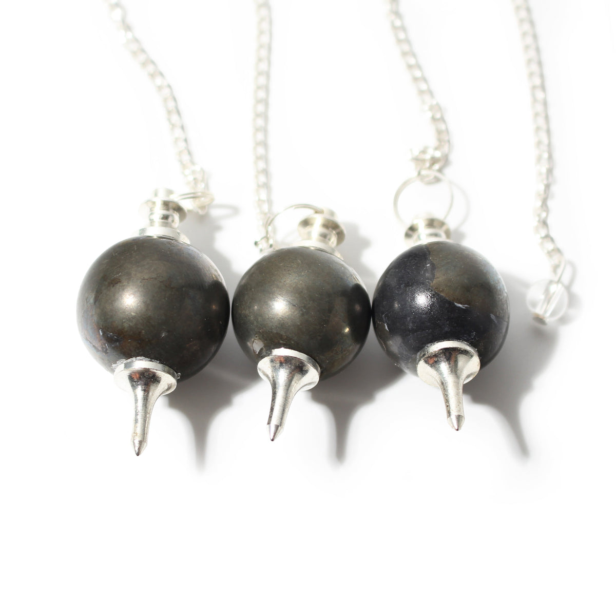 Pyrite Ball and Point Pendulum shown in a group; sold individually