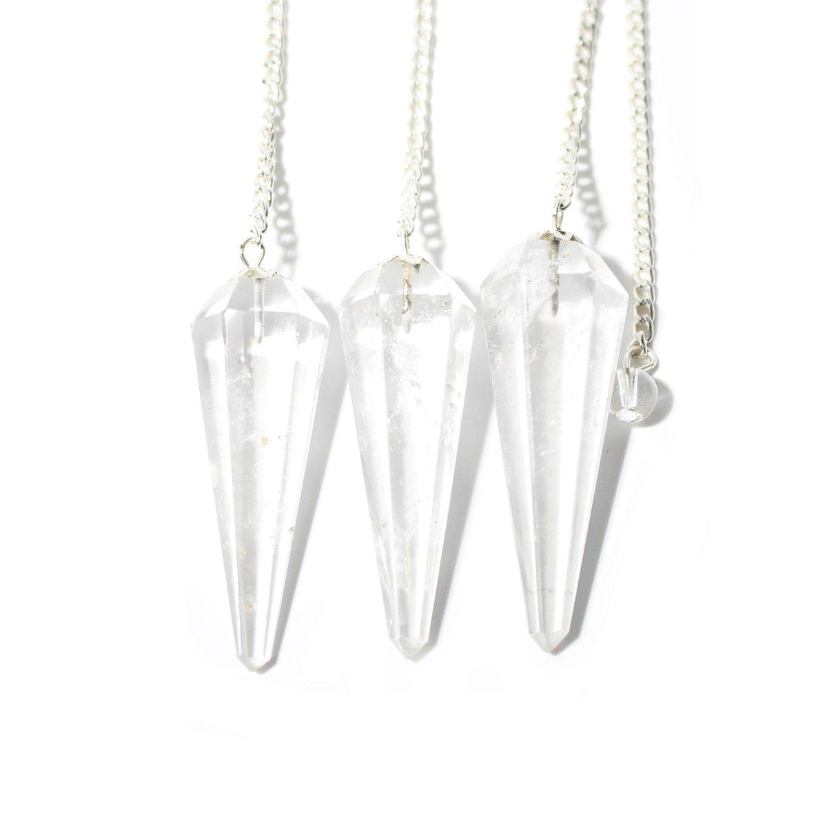 Clear Quartz Pendulum 6 Facet & Bead shown in a group; sold individually