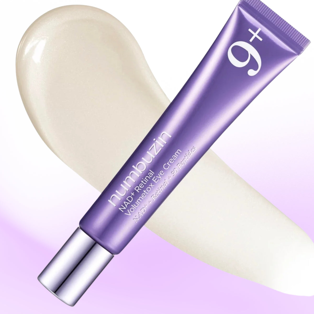 A tube of numbuzin - No.9 NAD+ Retinal Volumetox Eye Cream in a metallic purple packaging with a silver cap, shown diagonally over a cream-colored eye cream smear on a white and light purple gradient background.