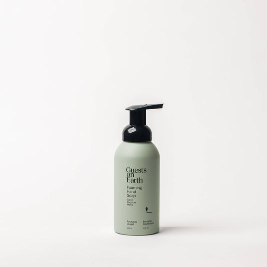 Guests on Earth Woodlands Foaming Hand Soap in a pale green bottle with a black foaming pump.