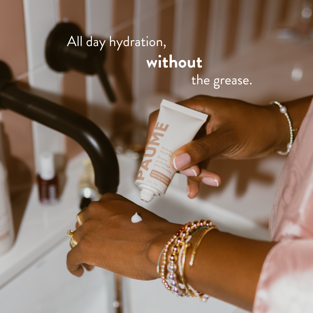 Hand applying PAUME Hand Balm with text 'All day hydration, without the grease.'