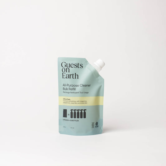 Guests on Earth Citrus Oasis All-Purpose Cleaner bulk refill pouch on a white surface.