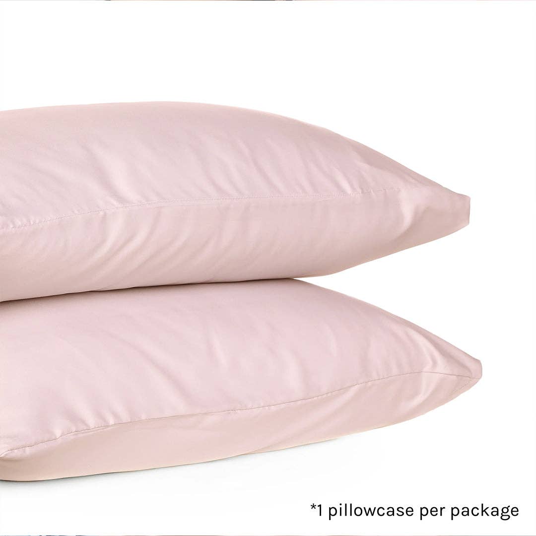 Two pale pink silk pillowcases stacked on a white background, with small text in the lower right reading '*1 pillowcase per package'.