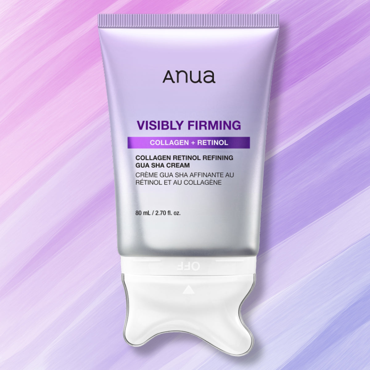 Anua Visibly Firming Collagen + Retinol Gua Sha Cream in a metallic silver squeeze tube with a white spatula applicator, set against a purple and lavender diagonal striped background.