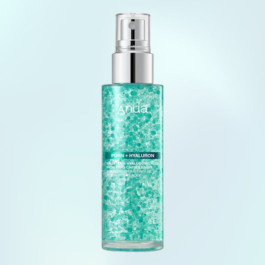 ANUA PDRN + Hyaluron skincare mist in a clear cylindrical bottle with a silver pump, filled with a sparkling teal-green liquid, set against a light blue gradient background.