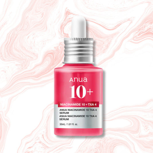 Anua 10+ Serum in a pink bottle with a white dropper cap and silver collar, set against a white background with pink marble veining.