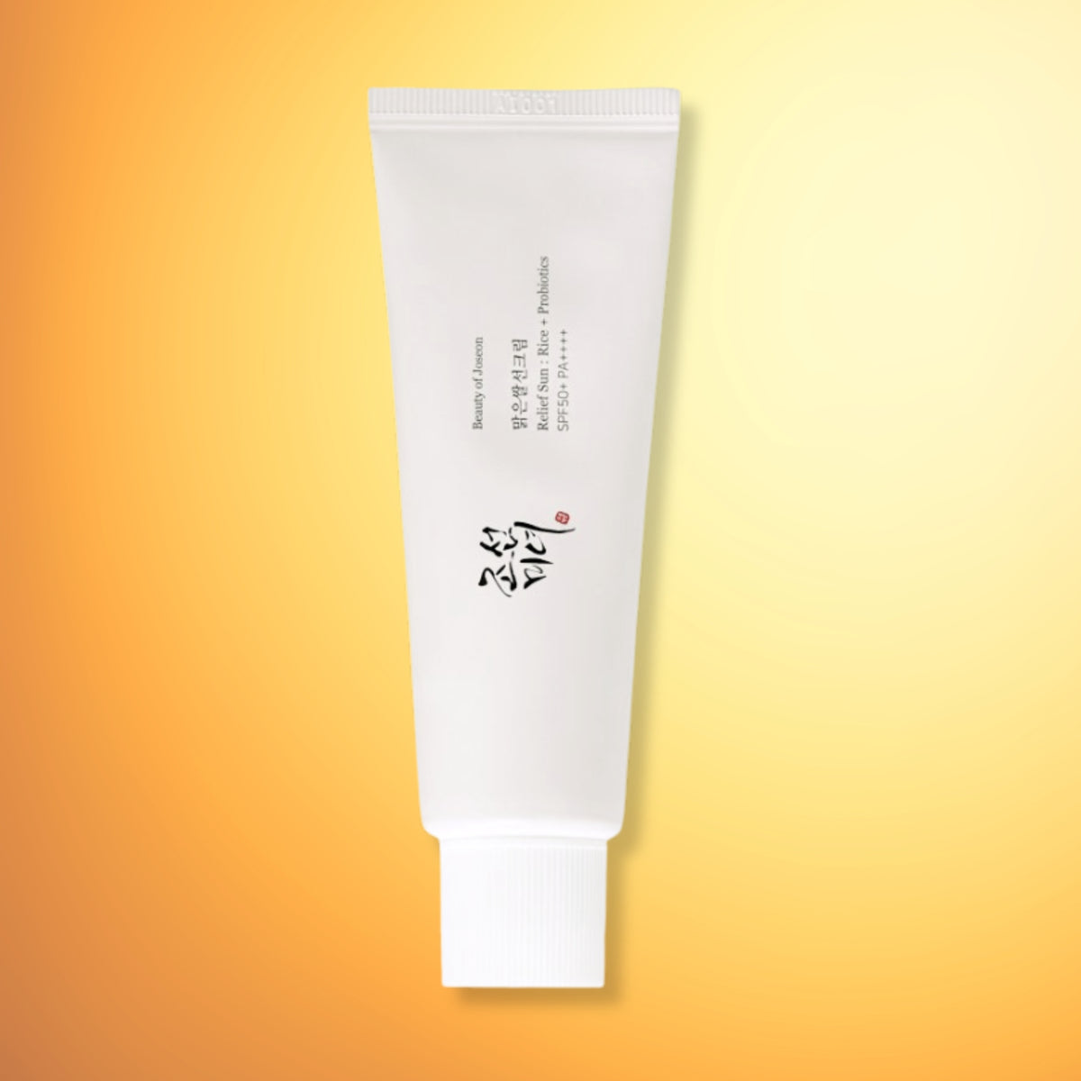 Beauty of Joseon - Relief Sun: Rice + Probiotics, centered on a warm yellow-to-orange gradient background.