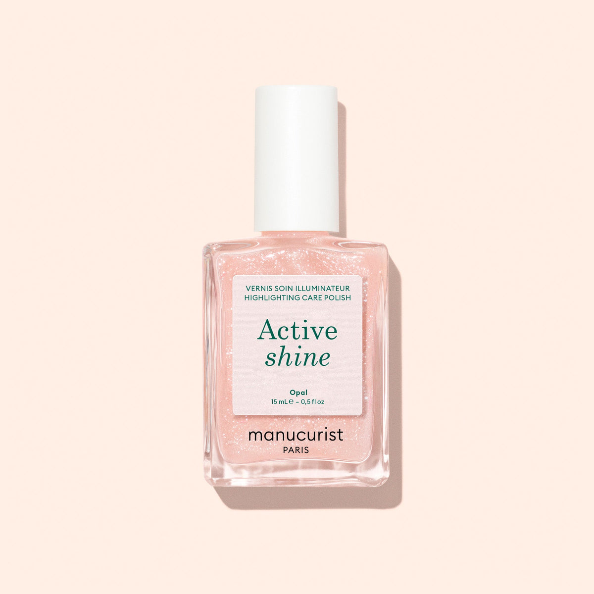 Manucurist Active Shine 15 mL bottle on a pale peach background