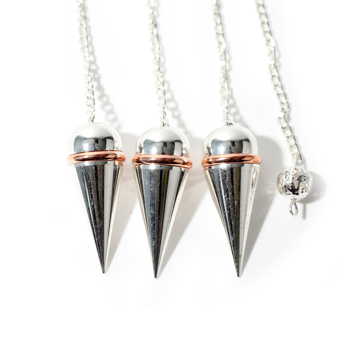 Silver Colour Metal Secret Chamber Point Pendulum with Copper Ring and Chain shown in a group; sold individually