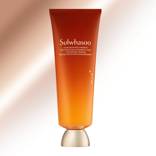 Sulwhasoo Concentrate Reviving Cleansing Foam in a translucent orange tube with a metallic gold cap, set against a soft beige and orange gradient background.