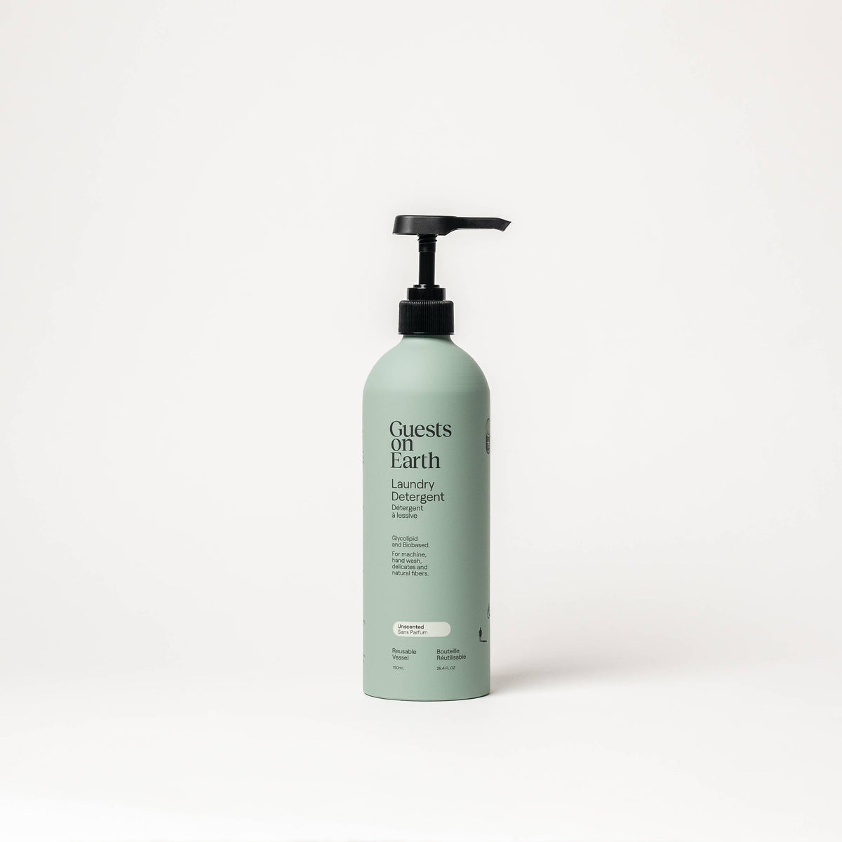 Guests on Earth Unscented Laundry Detergent in a pale green bottle with a black pump.