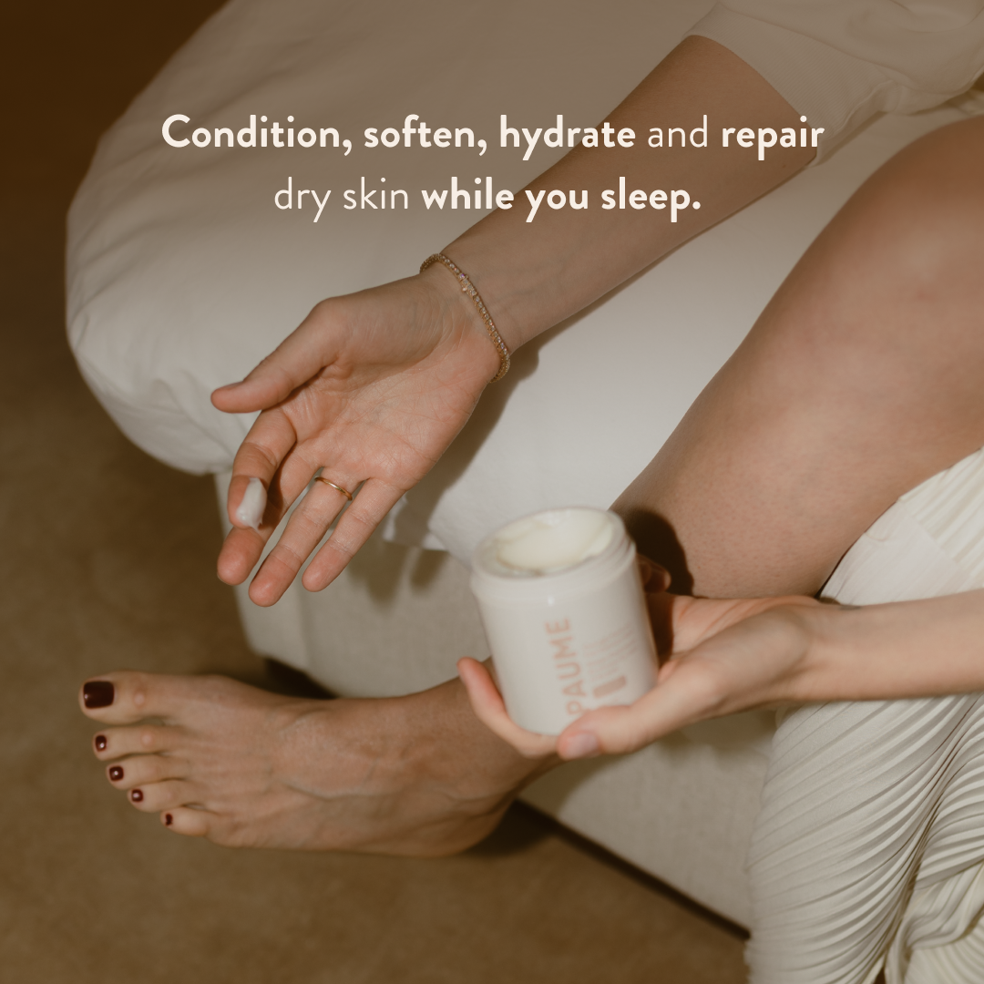 Person holding a jar of PAUME Overnight Hand & Foot Hydration Mask with text about skin care benefits.