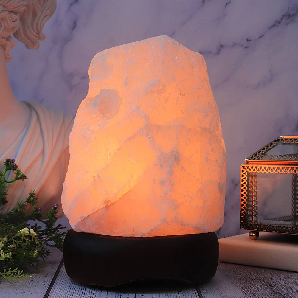 Rose Quartz lamp shaped like a rock with a marble background
