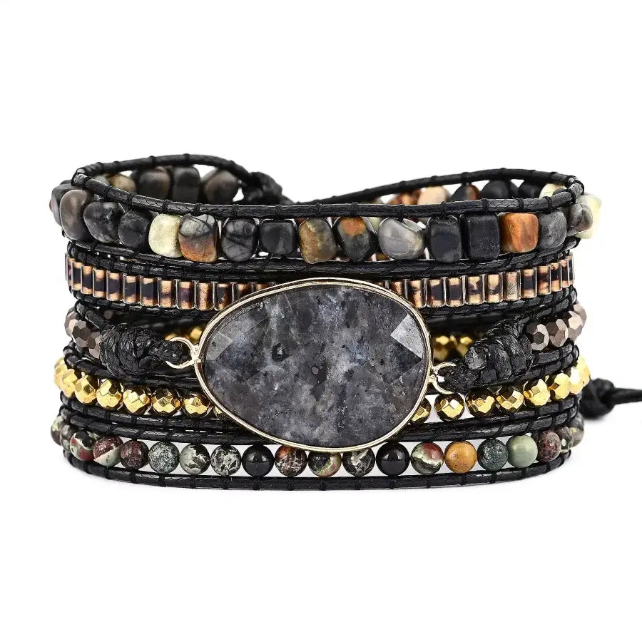 Multistrand bracelet with stones and a central stone on a white background