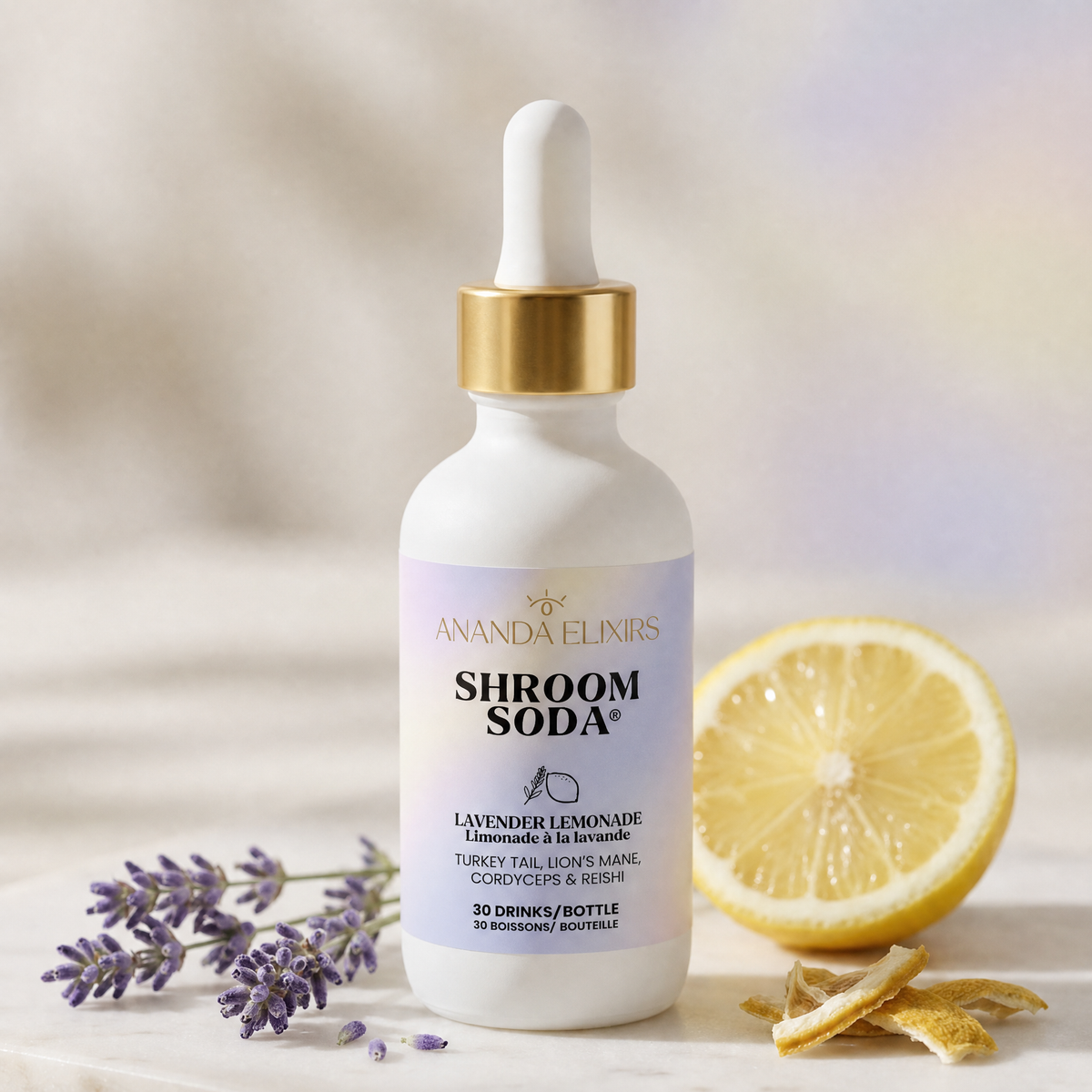 A bottle of Amanda Elkirs Shroom Soda herbal supplement, styled on a marble surface with lavender sprigs, a lemon slice, and dried lemon peel against a soft, warm blurred background.
