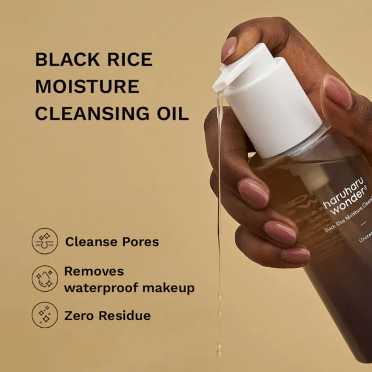 A hand with pink manicured nails pumps Haruharu Wonder Black Rice Moisture Cleansing Oil from a clear bottle with a white dispenser. The background is a solid warm beige, with text on the left reading 'BLACK RICE MOISTURE CLEANSING OIL' and three feature icons and text below.