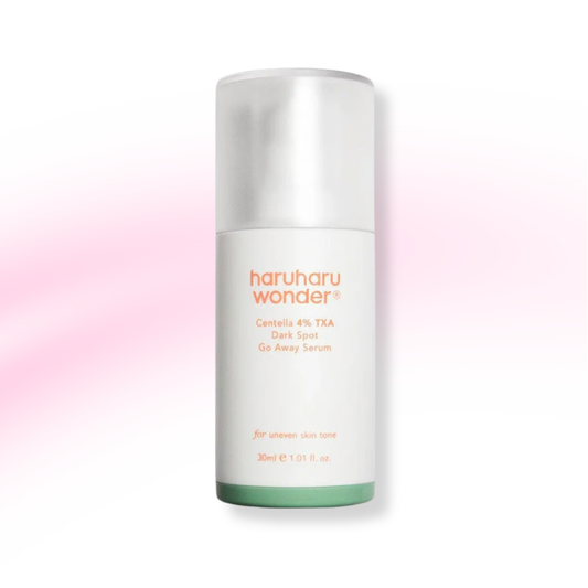 A 30ml bottle of haruharu wonder Centella 4% TXA Dark Spot Go Away Serum, featuring a white bottle with orange text and a light green base, set against a white background with a soft pink glow.