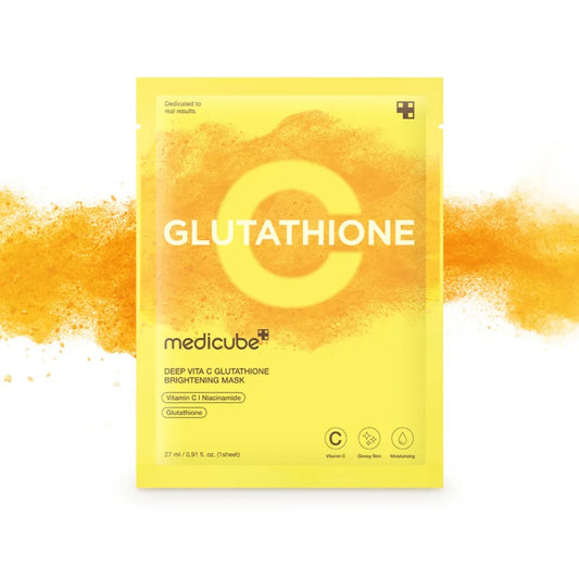 medicube Glutathione deep vitamin C glutathione brightening mask packet, shown against a white background with orange powder splashes extending from behind it.