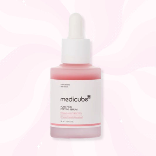 medicube PDRN PINK PEPTIDE SERUM in a frosted glass dropper bottle with pink liquid inside and a white label, set against a light pink wavy background.