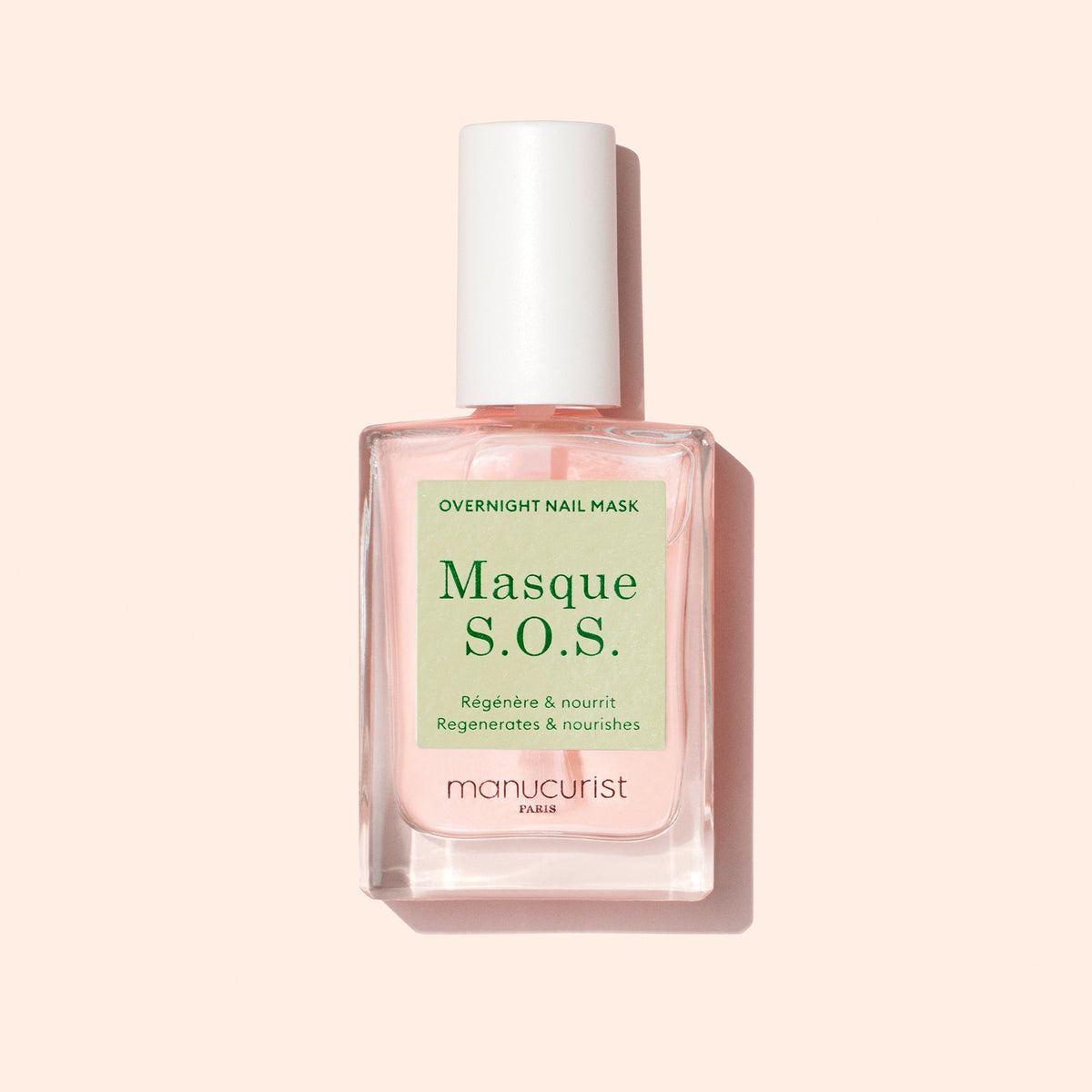 Manucurist S.O.S. Mask 15 mL bottle on a pale peach background
